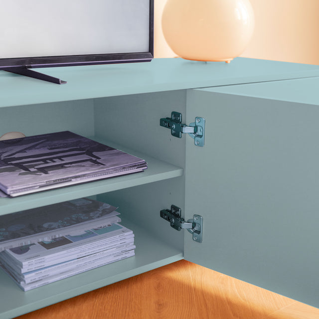 Vista lateral detalle Mueble TV Nolla 200 cm Azul cielo puerta abierta balda apoyado suelo con niveladores Slowdeco